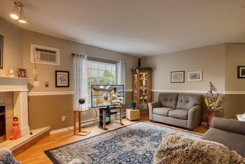 101-374 Winnipeg Street, Penticton, BC - Indoor Photo Showing Living Room With Fireplace