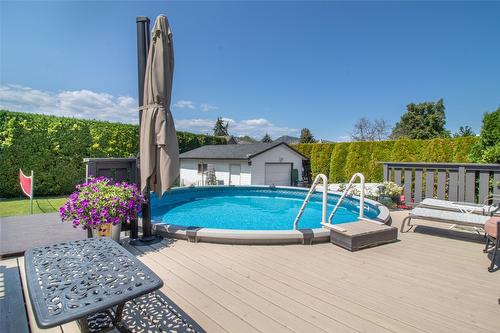 1310 Mary Court, Kelowna, BC - Outdoor With Above Ground Pool With Deck Patio Veranda