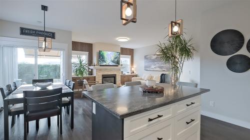 2084 Clover Drive, West Kelowna, BC - Indoor Photo Showing Dining Room With Fireplace