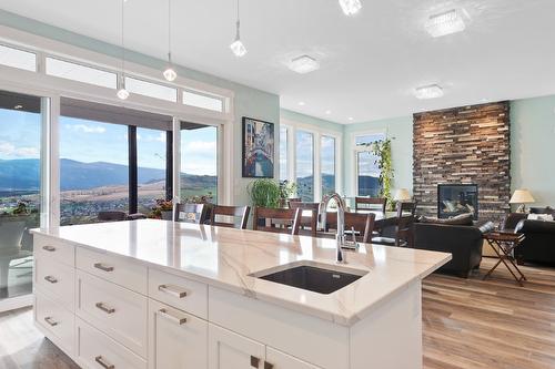 5048 Turtle Pond Place, Vernon, BC - Indoor Photo Showing Kitchen With Fireplace