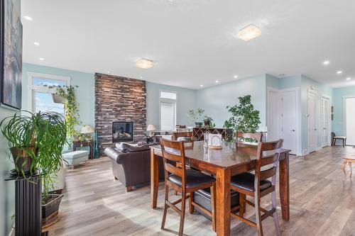 5048 Turtle Pond Place, Vernon, BC - Indoor Photo Showing Dining Room With Fireplace