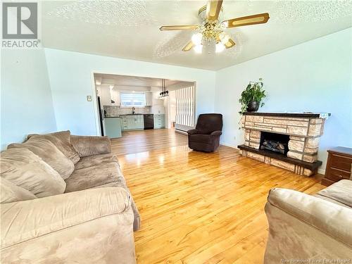 25 St-Simon Road, Caraquet, NB - Indoor Photo Showing Living Room With Fireplace