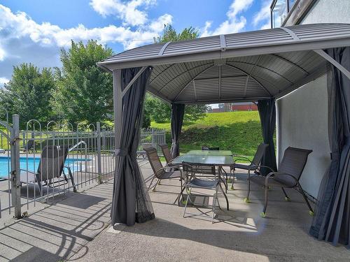 Pool - 413-2400 Av. De Lisieux, Québec (Beauport), QC - Outdoor With In Ground Pool With Deck Patio Veranda With Exterior