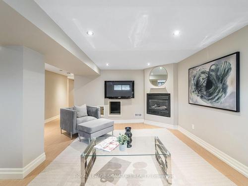 212 Cocksfield Ave, Toronto, ON - Indoor Photo Showing Living Room With Fireplace