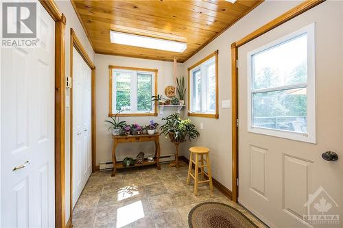 Sun filled mudroom leads to the deck and offers excellent storage - 3303 Drummond Conc 9A Township, Balderson, ON - Indoor Photo Showing Other Room