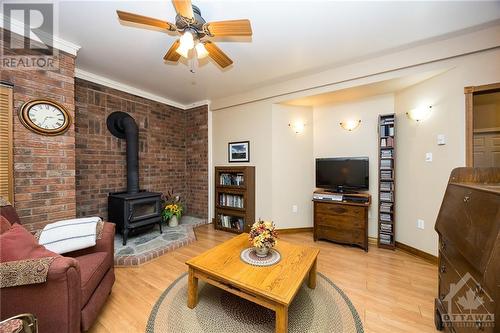 Family room with a wood stove perfect for cozy nights in - 3303 Drummond Conc 9A Township, Balderson, ON - Indoor Photo Showing Living Room With Fireplace