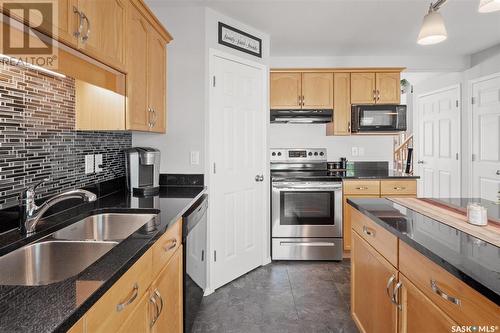 110 615 Mcwillie Avenue, Saskatoon, SK - Indoor Photo Showing Kitchen With Double Sink