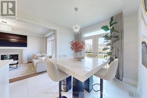 73 Fruitful Crescent, Whitby, ON - Indoor Photo Showing Dining Room With Fireplace