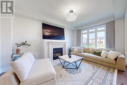 73 Fruitful Crescent, Whitby, ON - Indoor Photo Showing Living Room With Fireplace