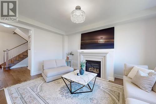 73 Fruitful Crescent, Whitby, ON - Indoor Photo Showing Living Room With Fireplace