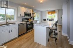 Looking down the kitchen patio doors lead to the deck - 