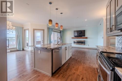 13 Megan Ridge Drive, Portugal Cove - St. Philips, NL - Indoor Photo Showing Kitchen With Fireplace With Upgraded Kitchen