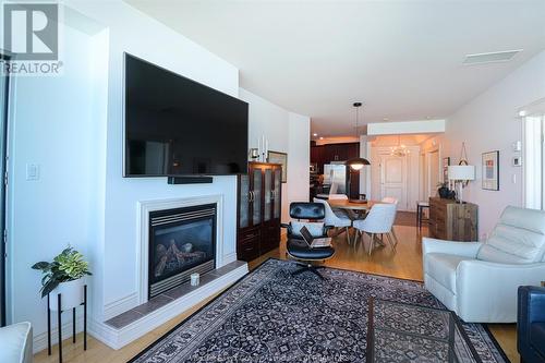 1225 Riverside Unit# 605, Windsor, ON - Indoor Photo Showing Living Room With Fireplace