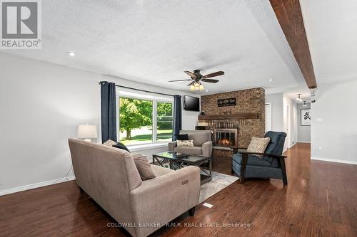 1076 Sandringham Road, Kawartha Lakes, ON - Indoor Photo Showing Living Room With Fireplace