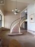 Stairway with baseboard heating, carpet flooring, and a notable chandelier - 24 Midland Drive Unit# 301, Kitchener, ON  - Indoor Photo Showing Other Room 