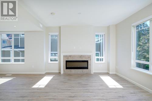 143 1330 Wellon Street, Coquitlam, BC - Indoor Photo Showing Living Room With Fireplace