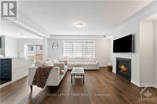 612 Rye Grass Way, Ottawa, ON - Indoor Photo Showing Living Room With Fireplace