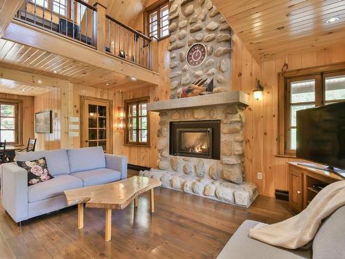 Living room - 131 Ch. Du Mont-Corbeau S., Saint-Adolphe-D'Howard, QC - Indoor Photo Showing Living Room With Fireplace