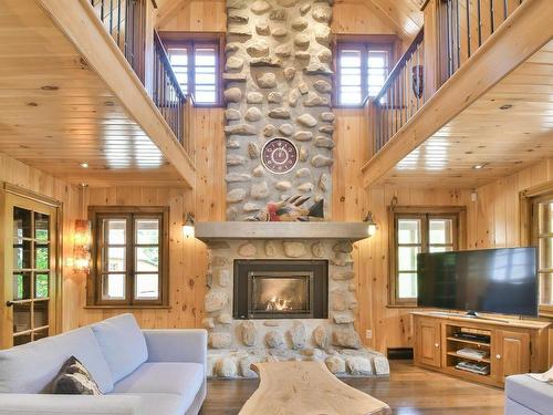 Living room - 131 Ch. Du Mont-Corbeau S., Saint-Adolphe-D'Howard, QC - Indoor Photo Showing Living Room With Fireplace