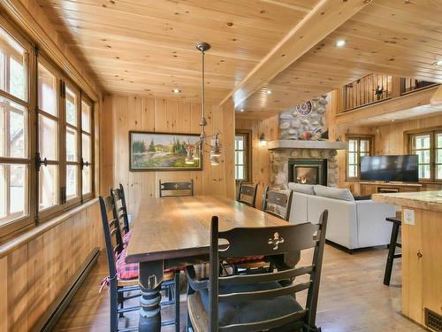 Dining room - 131 Ch. Du Mont-Corbeau S., Saint-Adolphe-D'Howard, QC - Indoor Photo Showing Dining Room With Fireplace