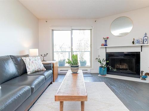 302-1241 Fairfield Rd, Victoria, BC - Indoor Photo Showing Living Room With Fireplace