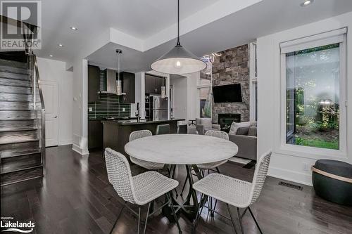 48 Carrick Trail, Gravenhurst, ON - Indoor Photo Showing Dining Room With Fireplace