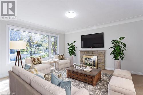 458 Three Valleys Crescent, London, ON - Indoor Photo Showing Living Room With Fireplace