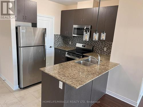 516 - 39 New Delhi Drive, Markham, ON - Indoor Photo Showing Kitchen With Stainless Steel Kitchen With Double Sink With Upgraded Kitchen