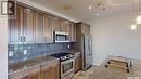 307 1715 Badham Boulevard, Regina, SK  - Indoor Photo Showing Kitchen With Upgraded Kitchen 