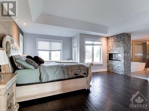 1680 Linkland Court, Ottawa, ON - Indoor Photo Showing Bedroom With Fireplace