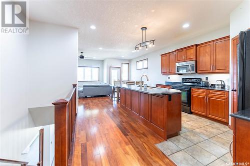 206 Muzyka Road, Saskatoon, SK - Indoor Photo Showing Kitchen With Double Sink