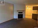 398 Cedar Meadow Drive, Regina, SK  - Indoor Photo Showing Living Room With Fireplace 