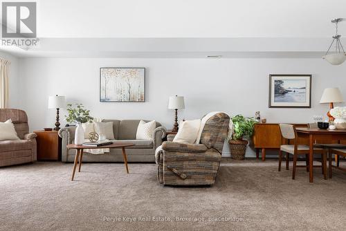 206 - 24 Dairy Lane, Huntsville (Chaffey), ON - Indoor Photo Showing Living Room