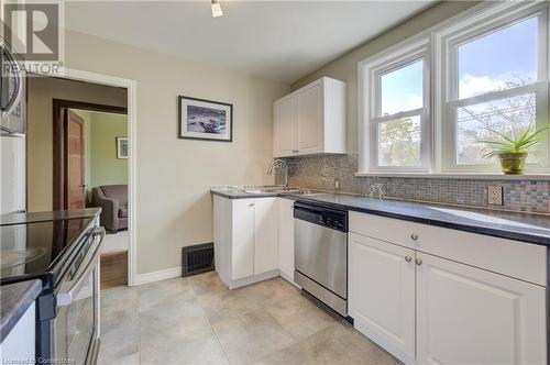 Large window overlooking backyard - 53 Hett Avenue, Kitchener, ON - Indoor Photo Showing Kitchen