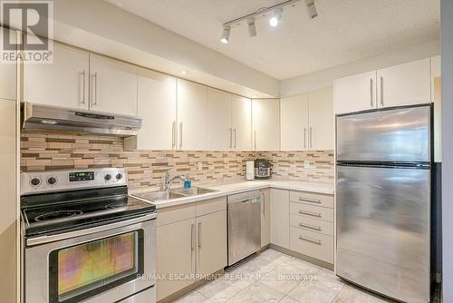 119 - 1300 Marlborough Court, Oakville, ON - Indoor Photo Showing Kitchen With Double Sink With Upgraded Kitchen