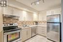 119 - 1300 Marlborough Court, Oakville, ON  - Indoor Photo Showing Kitchen With Double Sink With Upgraded Kitchen 