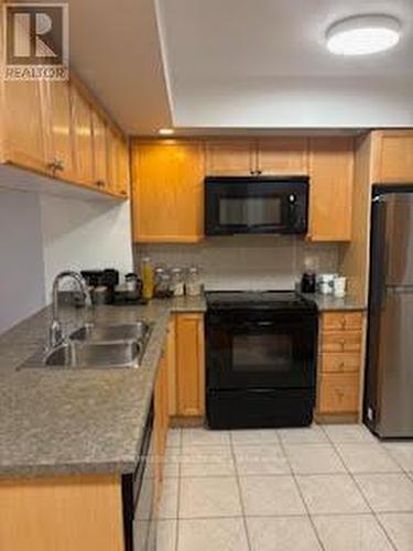 204 - 5229 Dundas Street W, Toronto, ON - Indoor Photo Showing Kitchen With Double Sink