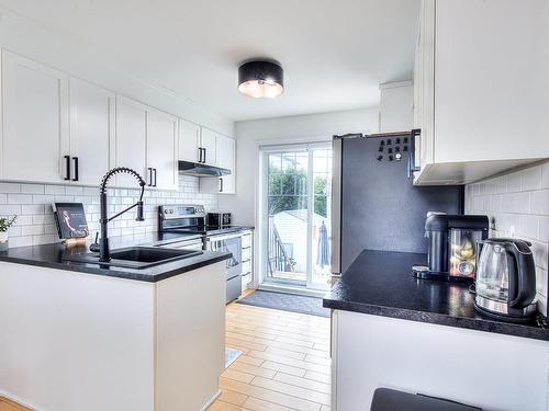 Kitchen - 151 Rue Cherie, Lavaltrie, QC - Indoor Photo Showing Kitchen With Upgraded Kitchen