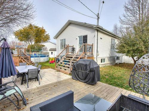 Backyard - 151 Rue Cherie, Lavaltrie, QC - Outdoor With Above Ground Pool With Deck Patio Veranda With Exterior