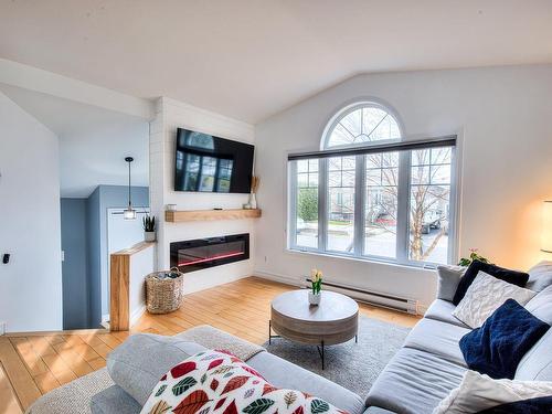 Living room - 151 Rue Cherie, Lavaltrie, QC - Indoor Photo Showing Living Room With Fireplace