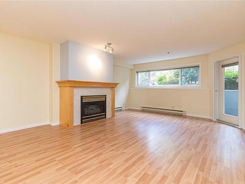 105-3009 Brittany Dr, Langford, BC - Indoor Photo Showing Living Room With Fireplace