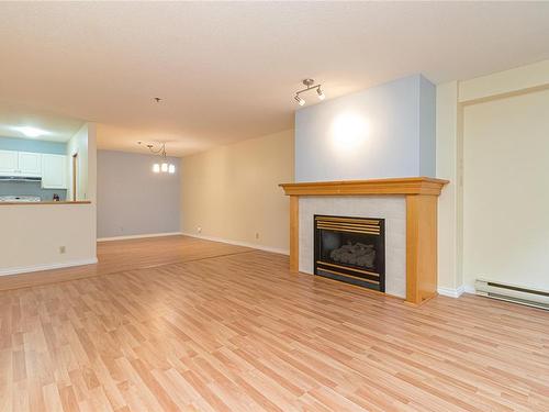 105-3009 Brittany Dr, Langford, BC - Indoor Photo Showing Living Room With Fireplace