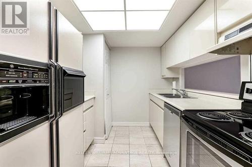 303 - 33 University Avenue, Toronto, ON - Indoor Photo Showing Kitchen With Double Sink