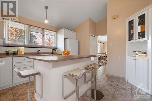 Photo is virtually staged. The rendering is to give ideas on how it could be set up to allow for an island with seating and pot drawers or extra storage. - 1349 Bloomsbury Crescent, Ottawa, ON - Indoor Photo Showing Kitchen