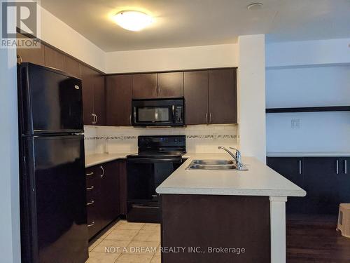 416 - 872 Sheppard Avenue W, Toronto, ON - Indoor Photo Showing Kitchen With Double Sink