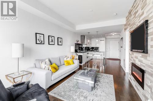 4903 - 8 The Esplanade, Toronto, ON - Indoor Photo Showing Living Room With Fireplace