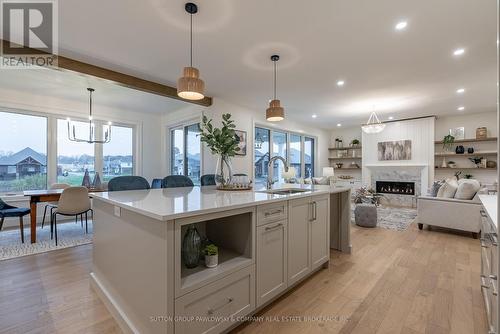 87 Allister Drive, Middlesex Centre (Kilworth), ON - Indoor Photo Showing Kitchen With Fireplace With Upgraded Kitchen