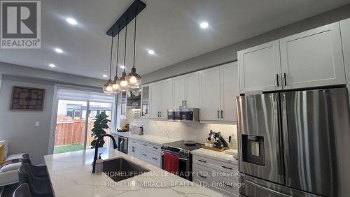 1319 Chee Chee Landing, Milton, ON - Indoor Photo Showing Kitchen With Stainless Steel Kitchen With Upgraded Kitchen