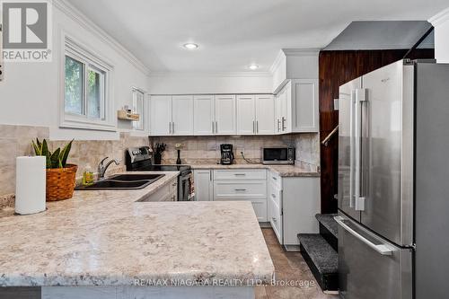 6525 O'Neil Street, Niagara Falls, ON - Indoor Photo Showing Kitchen With Double Sink