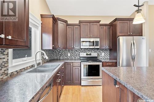 102 Balman Court, Waldheim, SK - Indoor Photo Showing Kitchen With Stainless Steel Kitchen With Double Sink With Upgraded Kitchen